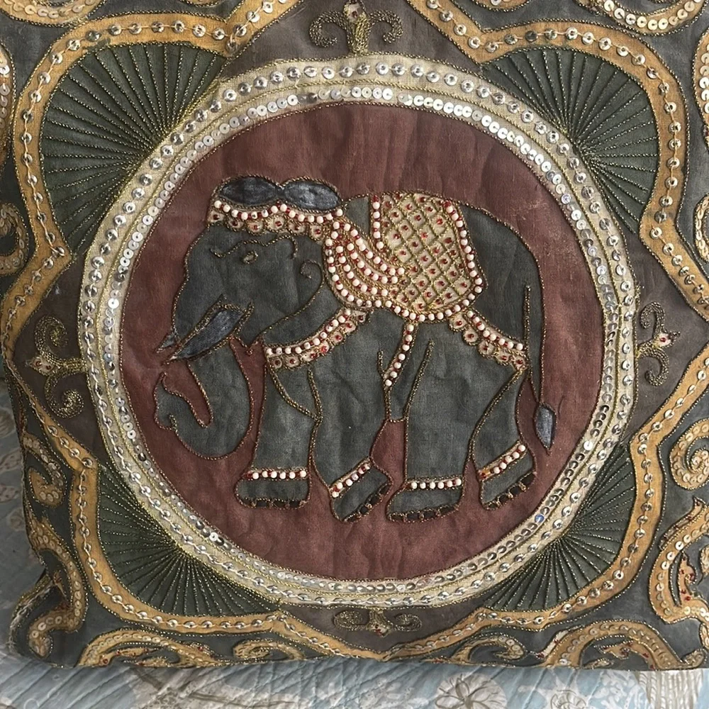 Elephant lovers this pillow is lovely exotic and quite intricate black silk back